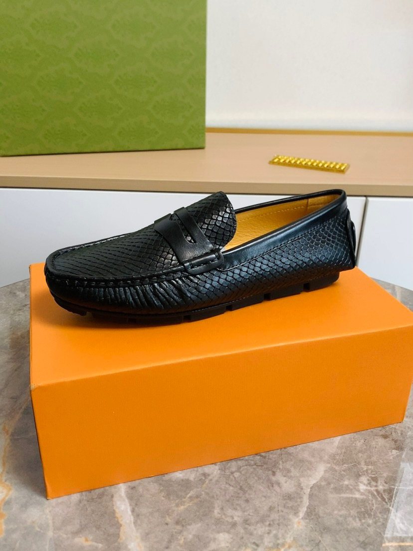 Louis Vuitton Textured Penny Loafers — model