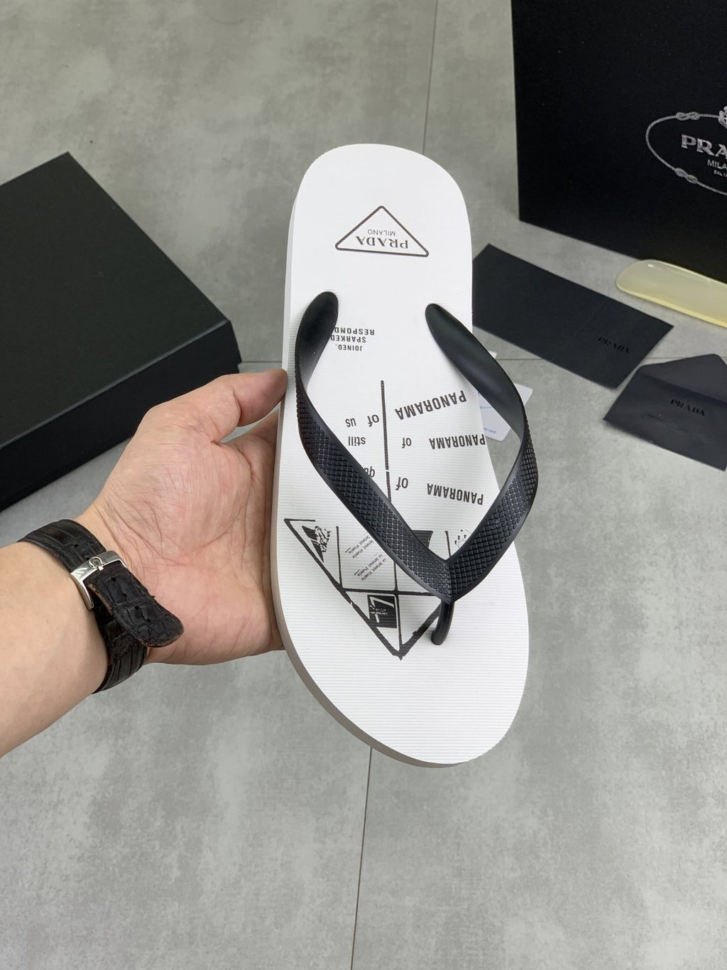 Prada Black Strap White Flip Flops — front